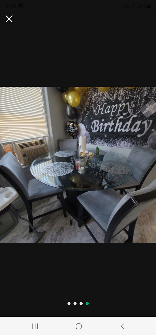Round Glass Dining Table with 4 Gray Chairs