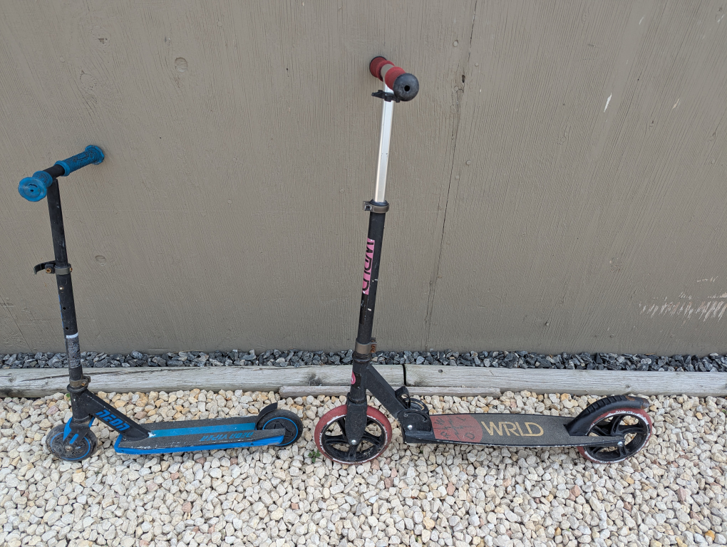 Two Used Scooters - Razor & WRLD