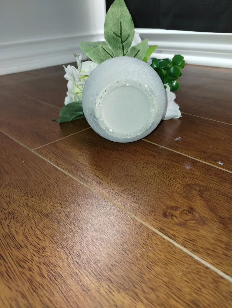 Artificial flowers in gray plaster pot image indicator(2)