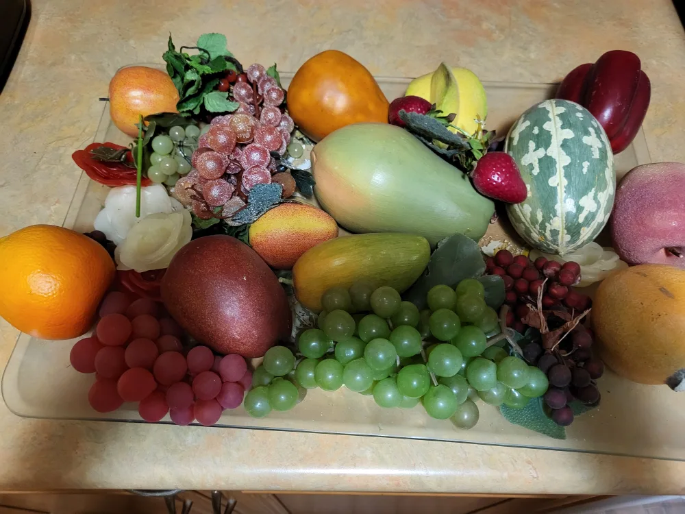 A dish of decorative fake fruits image indicator(2)