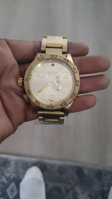 Gold Nixon watch thumbnail