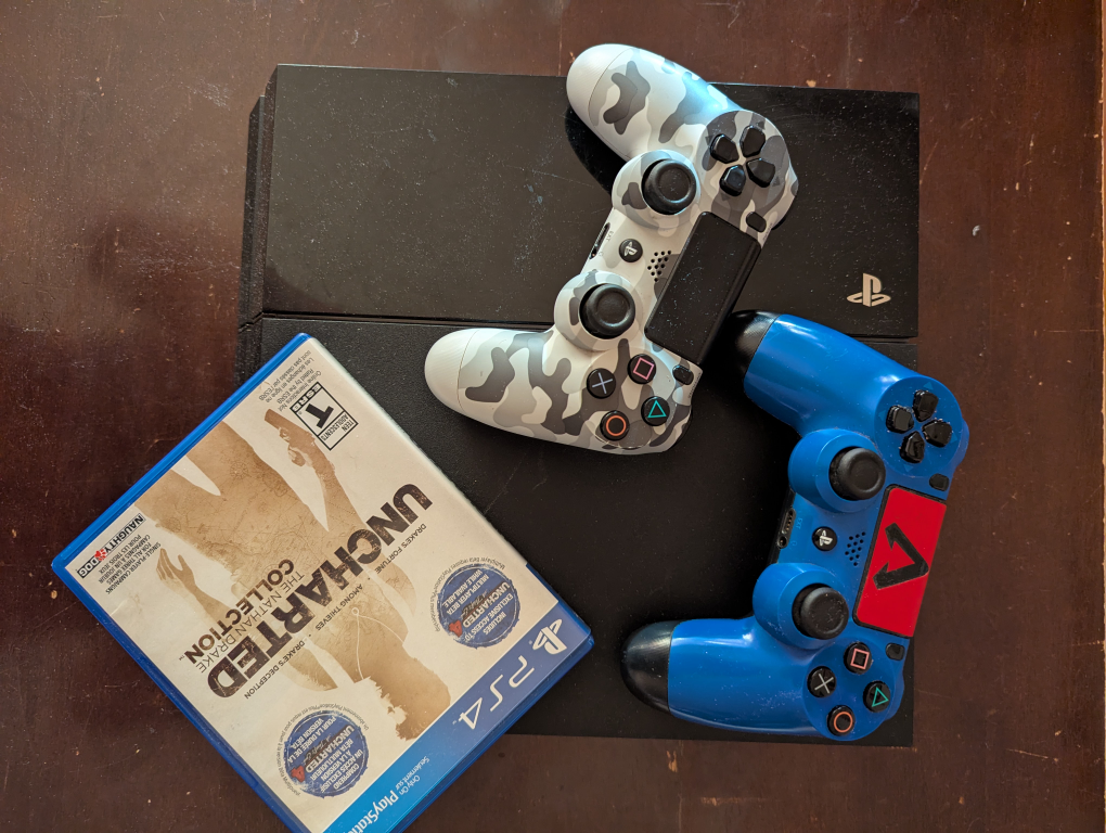 PS4 Console with Controllers and Uncharted