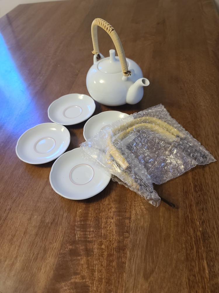 White Teapot with 4 Saucers