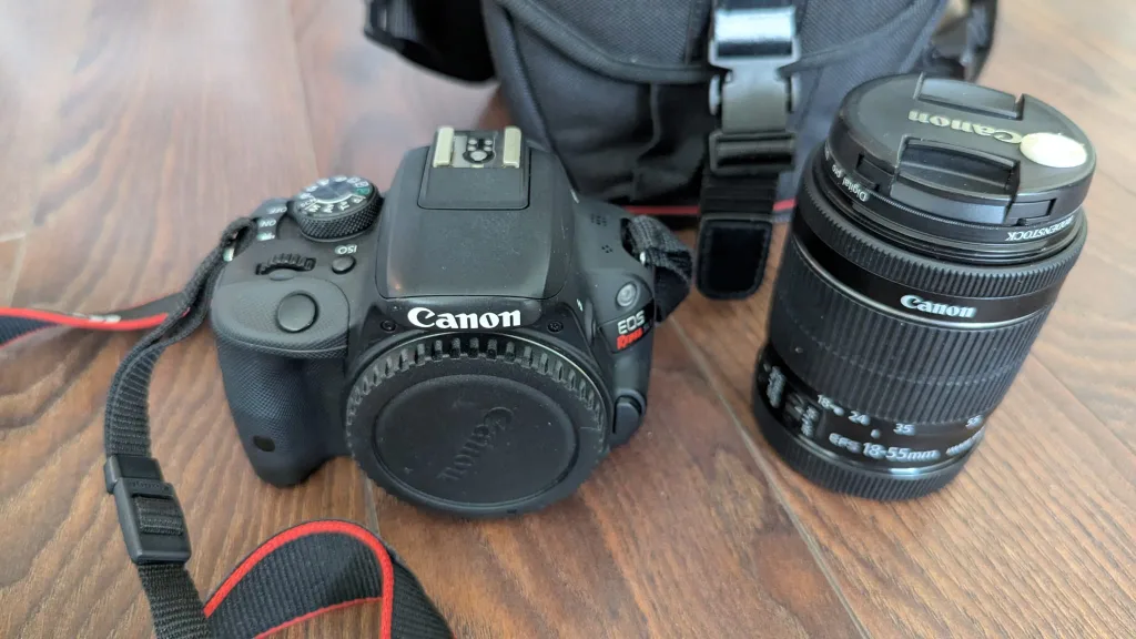 Canon EOS Rebel SL1 DSLR Camera + 18–55mm Lens + Camera Bag