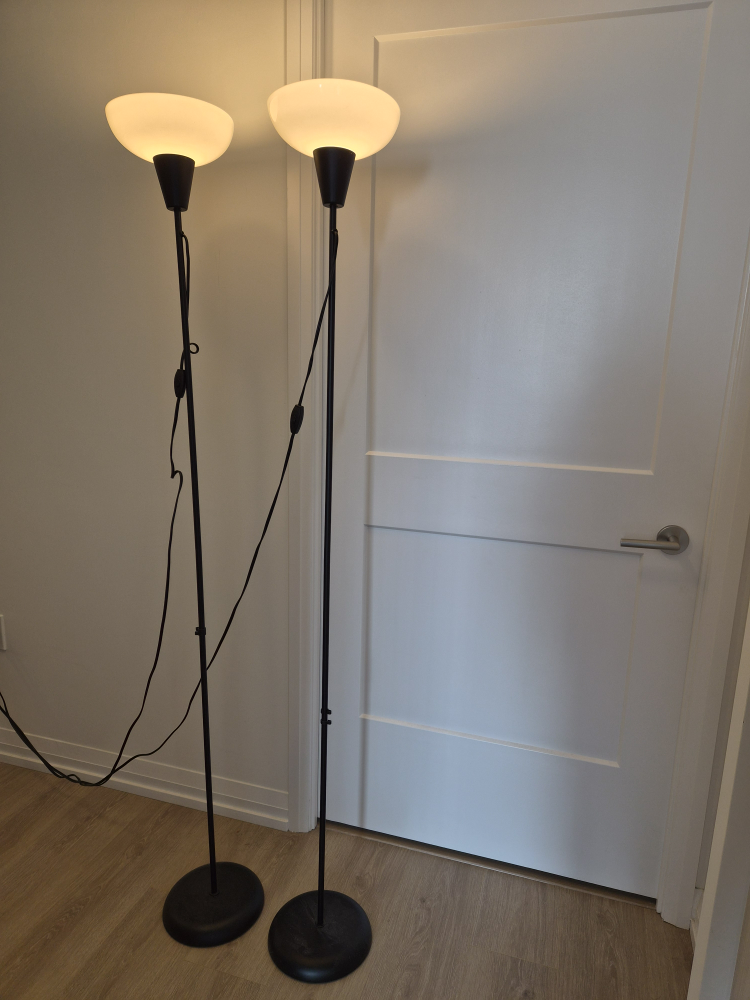2 black IKEA floor lamps