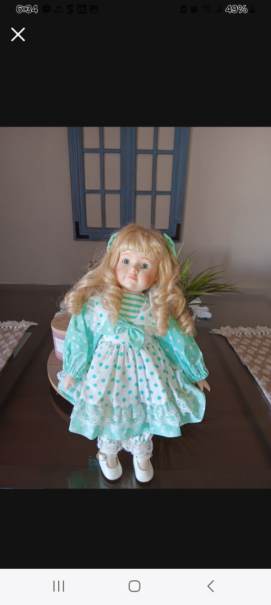 Collectible Porcelain Doll with Blonde Hair