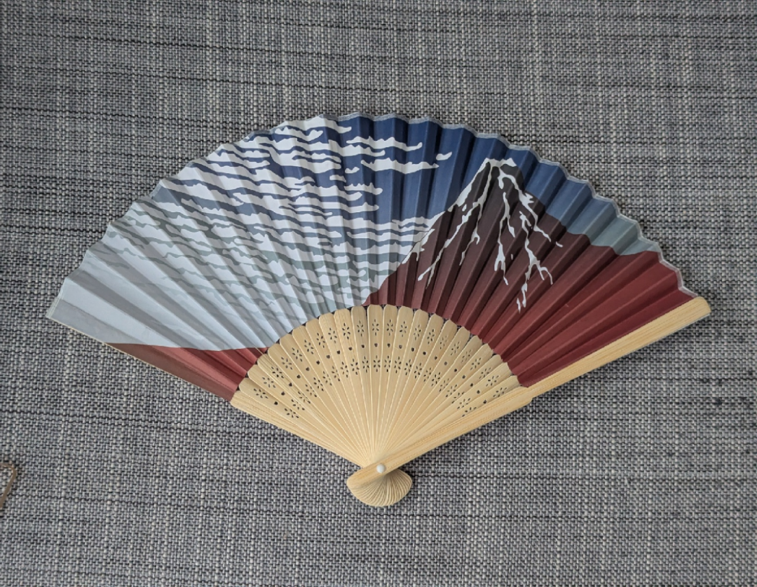 Japanese paper folding fan with Mt. Fuji design