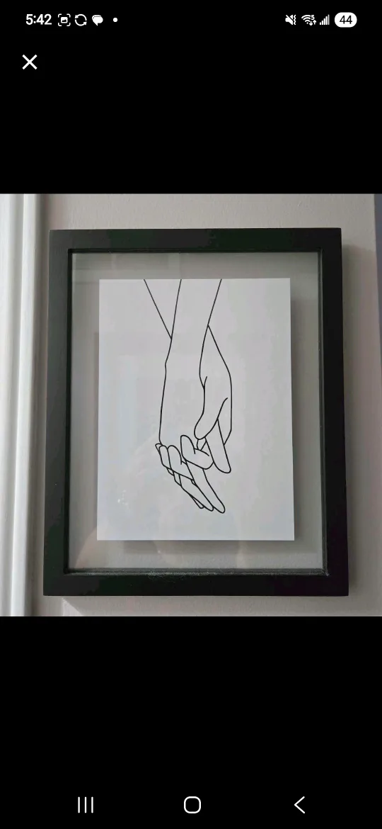 Framed Hand Holding Art Print thumbnail