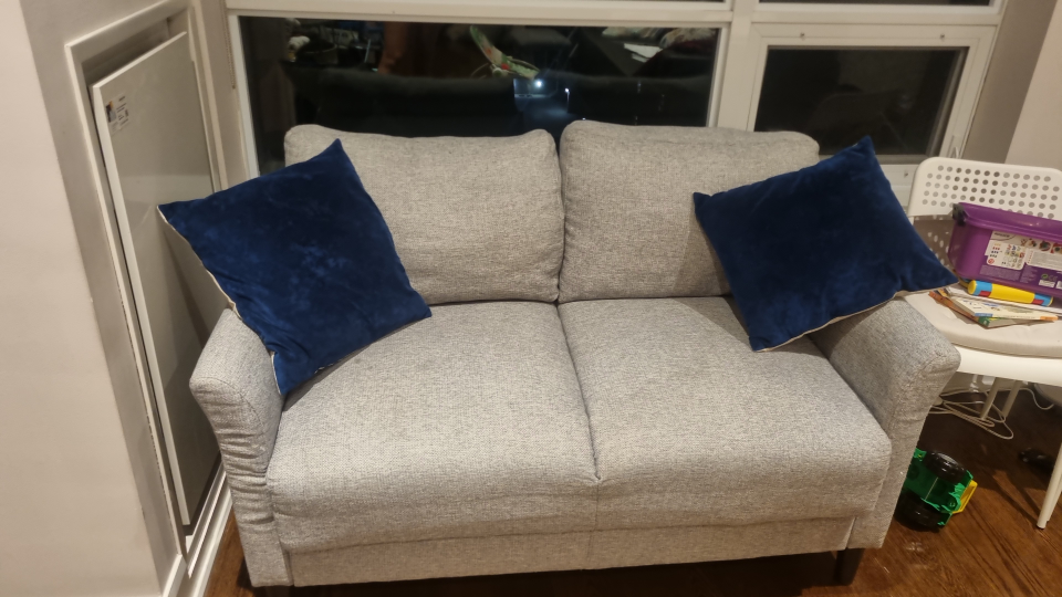 Light Grey Loveseat Sofa with Blue Pillows