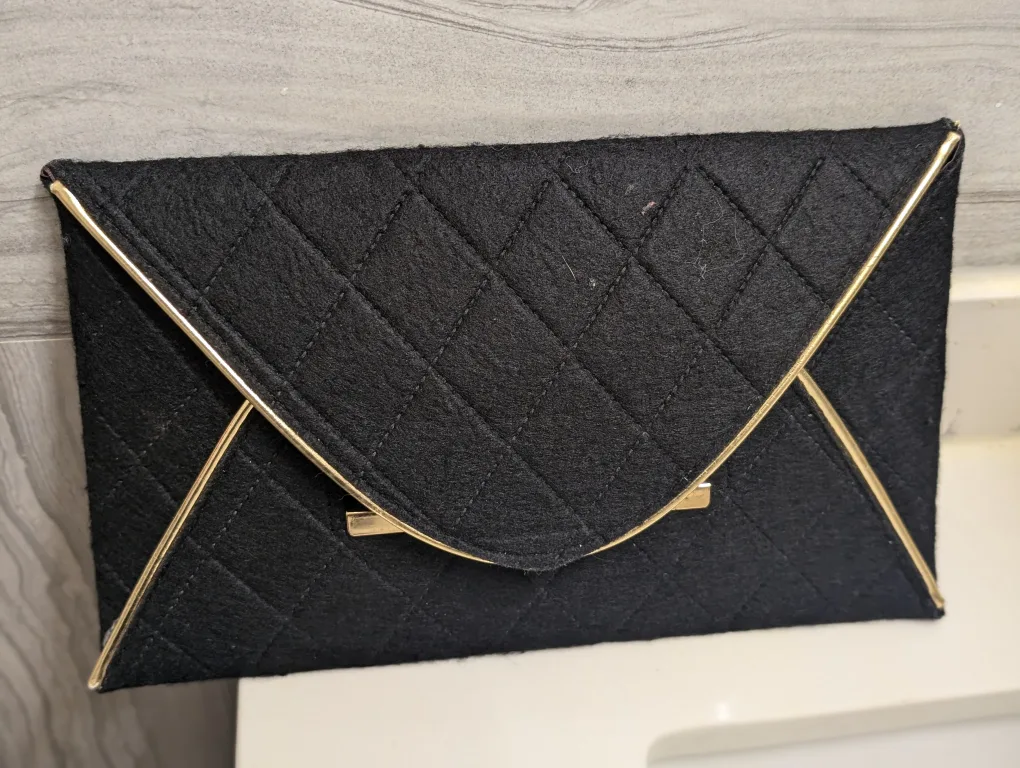Black Quilted Clutch with Gold Trim thumbnail