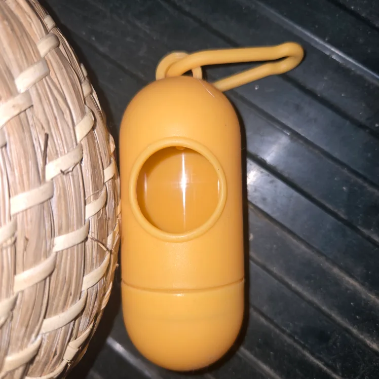 Yellow Plastic Poop Bag Dispenser thumbnail