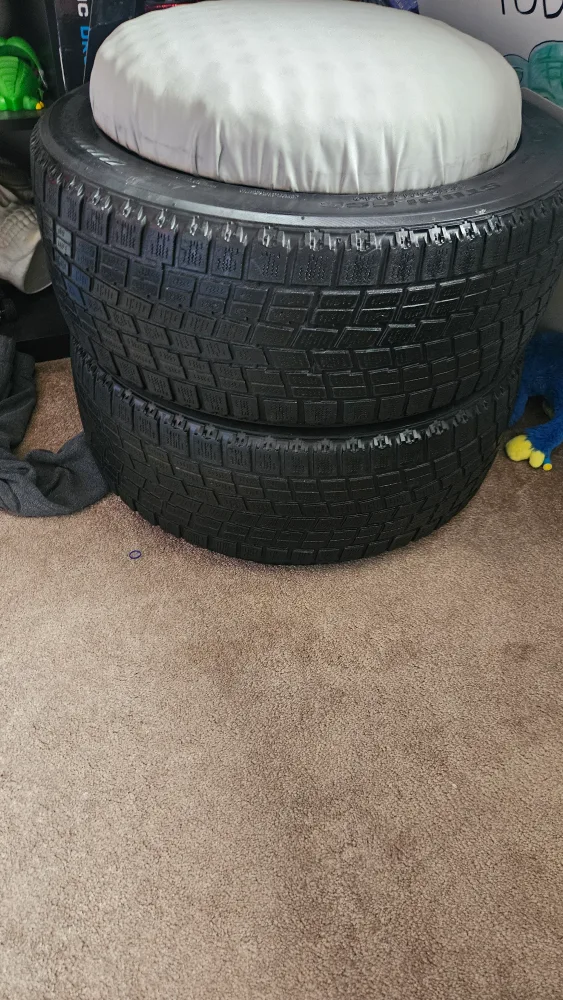 Tire Ottoman with White Cushion thumbnail