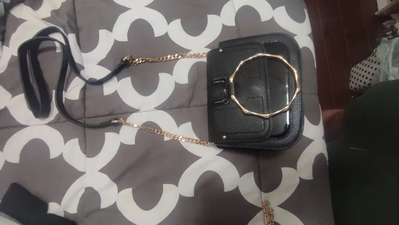 Black crossbody bag with gold accents thumbnail