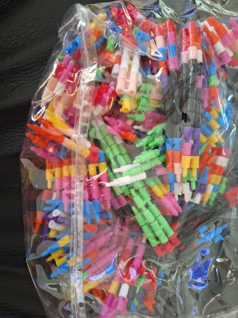 Bag of colourful plastic building sticks thumbnail