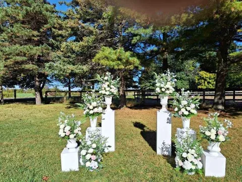 white wedding plinths/pedestal stands& faux floral arrangements image indicator(8)
