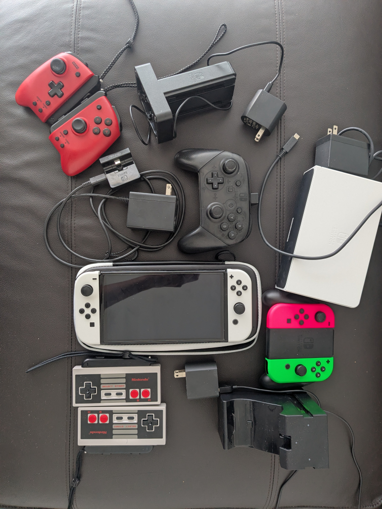 nintendo switch oled + controllers + chargers $325 obo