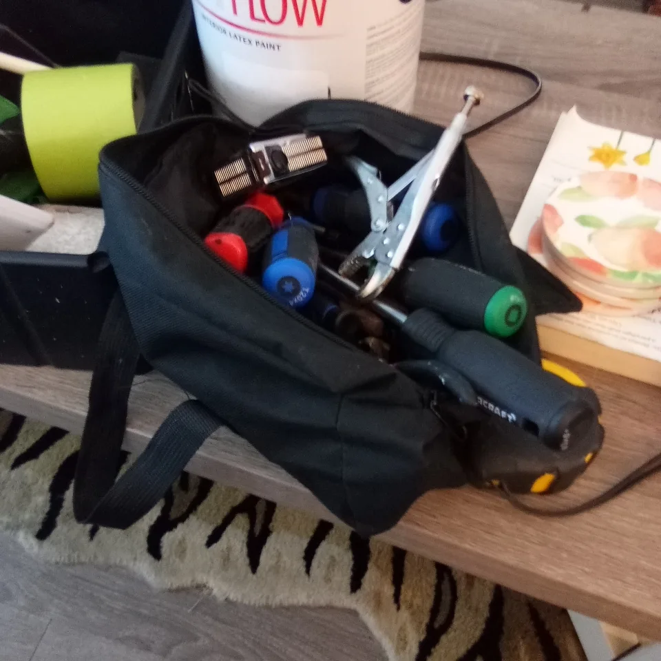 Tool bag with various tools thumbnail