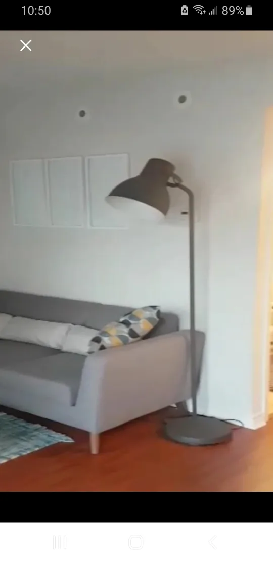 A tall floor lamp with a large, round shade. 75$ thumbnail