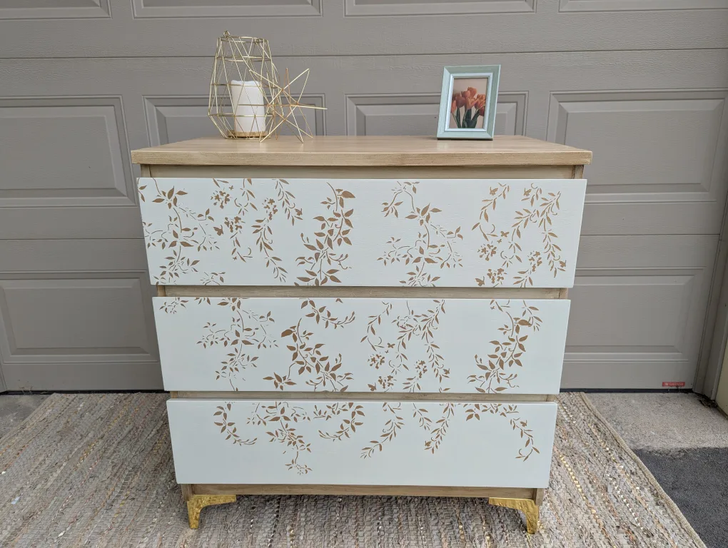 Newly refinished three drawer dresser with floral detail image indicator(2)