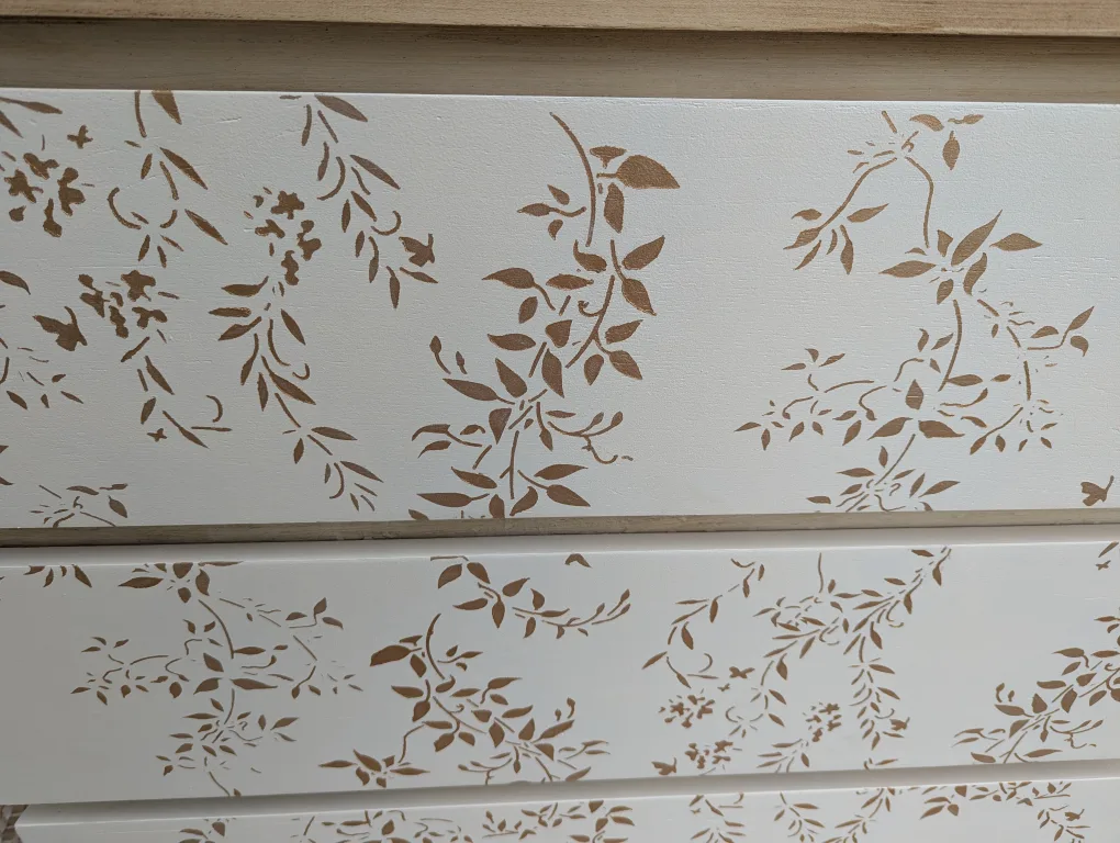 Newly refinished three drawer dresser with floral detail image indicator(5)