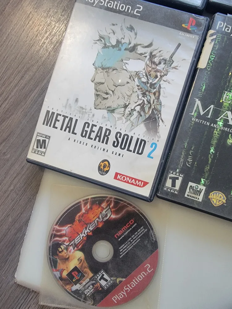 PlayStation 2 console + 7 games image indicator(7)