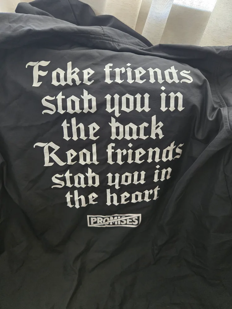 Broken Promises raincoat image indicator(2)