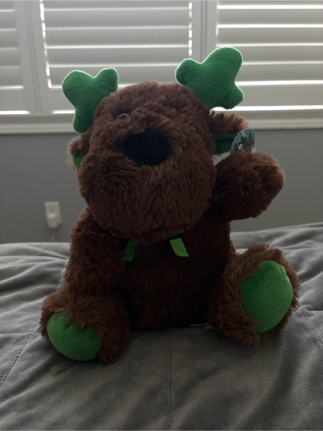 Brown Reindeer Plush Toy with Green Accents thumbnail