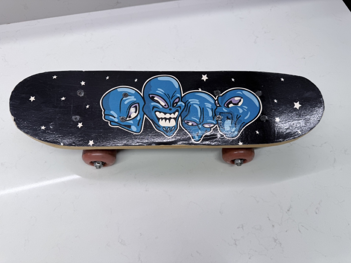 Skateboard with Alien Design