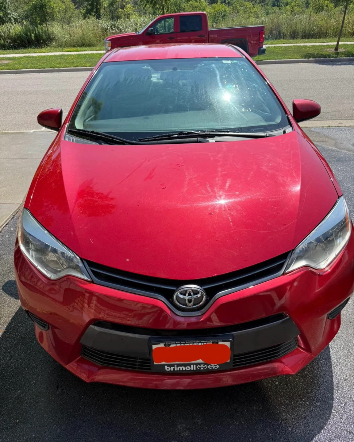 Red Toyota Corolla LE 2015