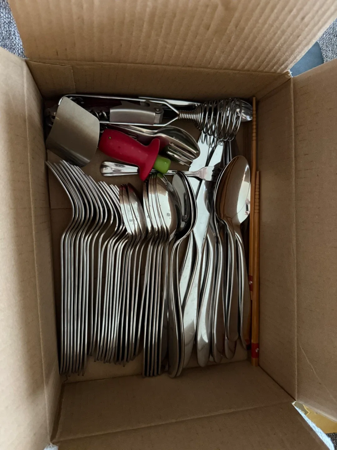 Box of assorted kitchen utensils thumbnail