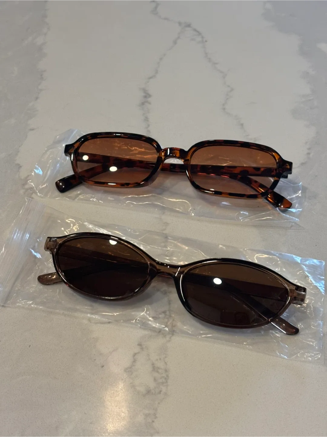 Two Pairs of Sunglasses thumbnail