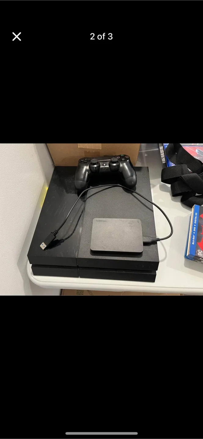 PlayStation 4 with two controllers and 5 games thumbnail