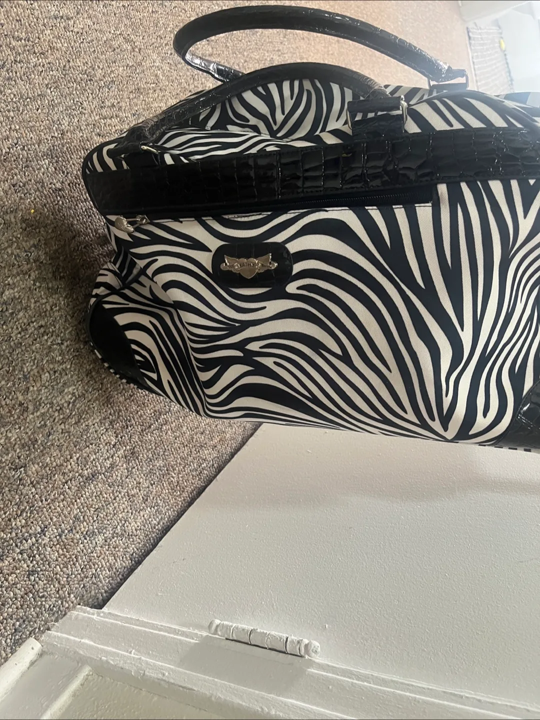 Kathy Van Zeeland Zebra Print Rolling Duffel Bag image indicator(8)