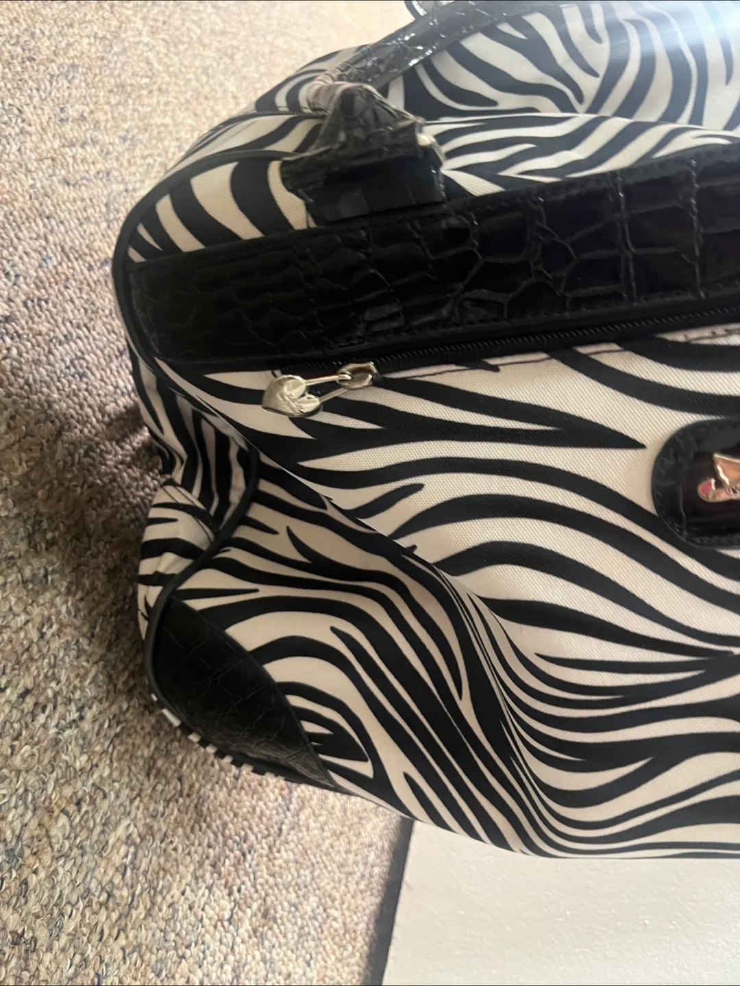 Kathy Van Zeeland Zebra Print Rolling Duffel Bag image indicator(7)