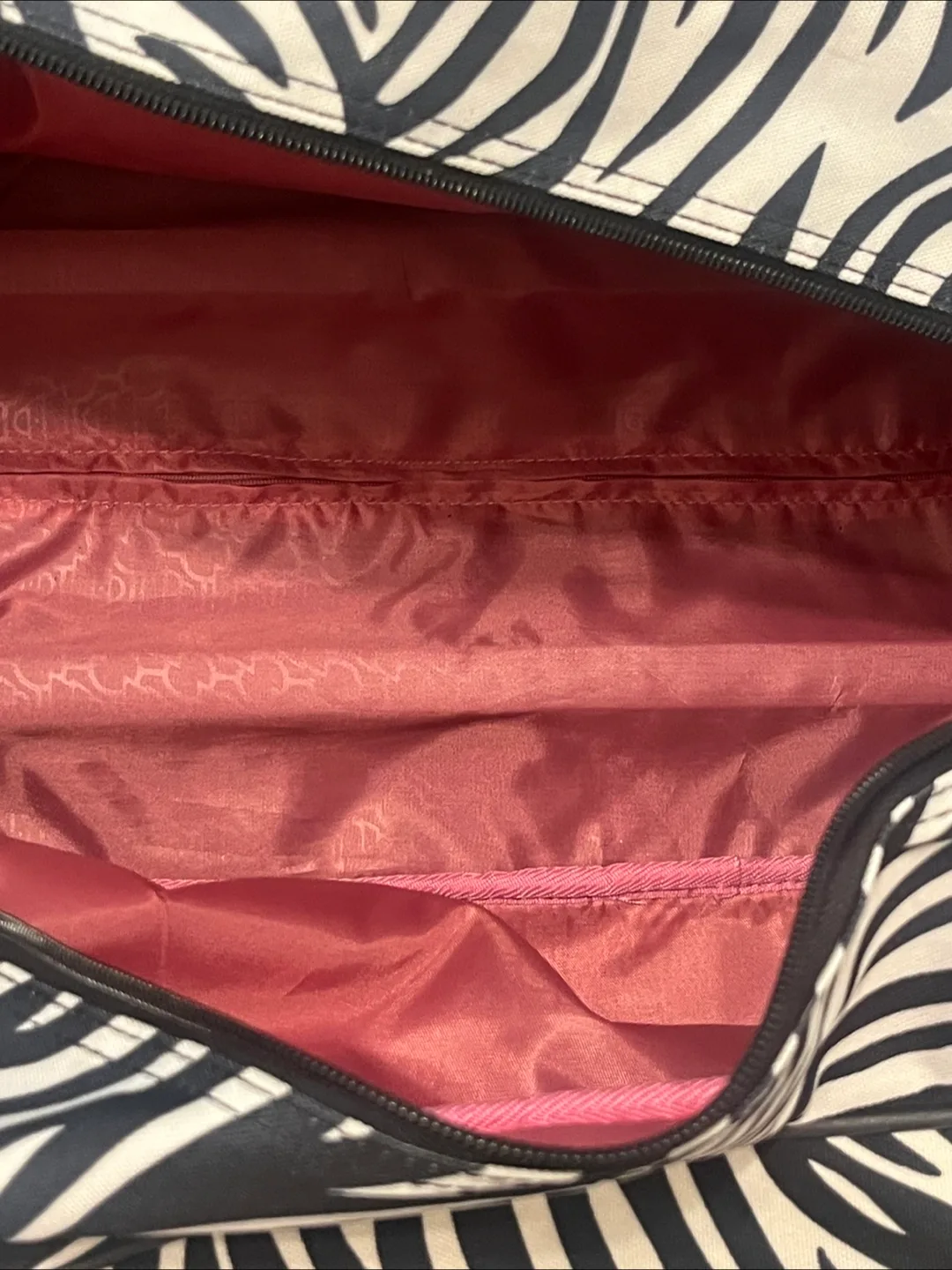 Kathy Van Zeeland Zebra Print Rolling Duffel Bag image indicator(10)