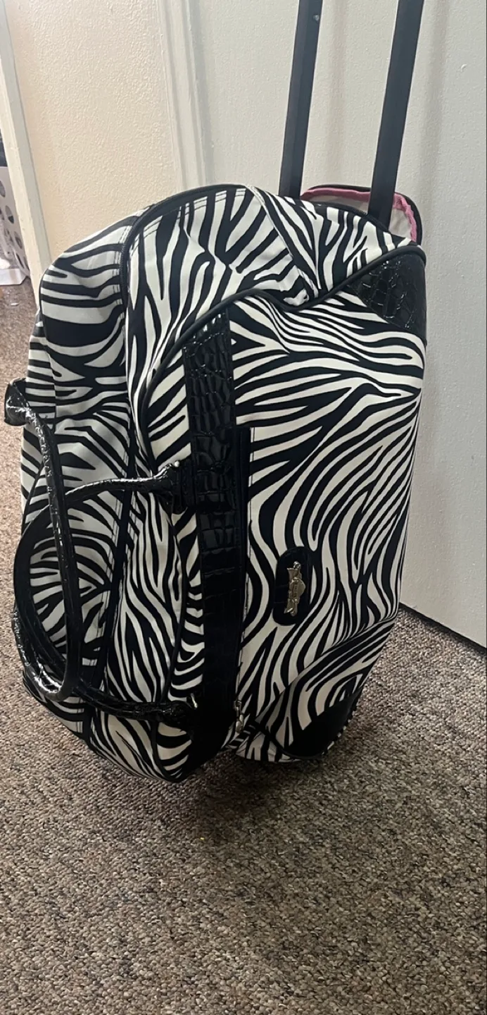 Kathy Van Zeeland Zebra Print Rolling Duffel Bag image indicator(6)