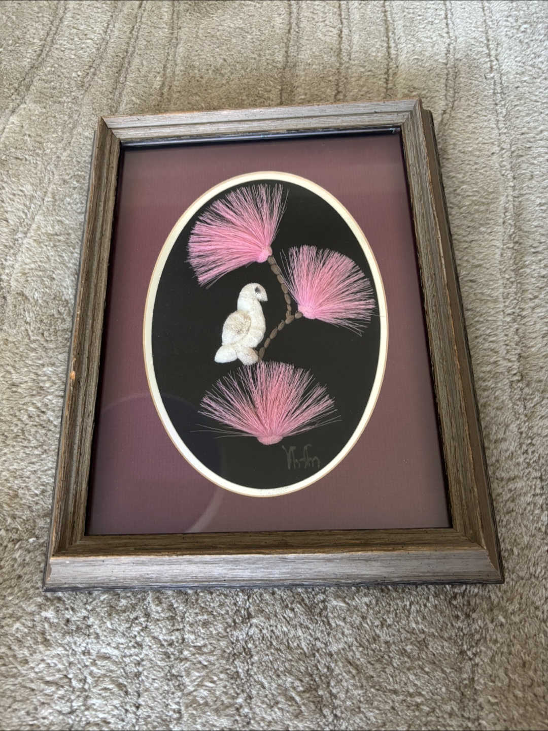 Framed Indigenous art featuring moosehair tufting
