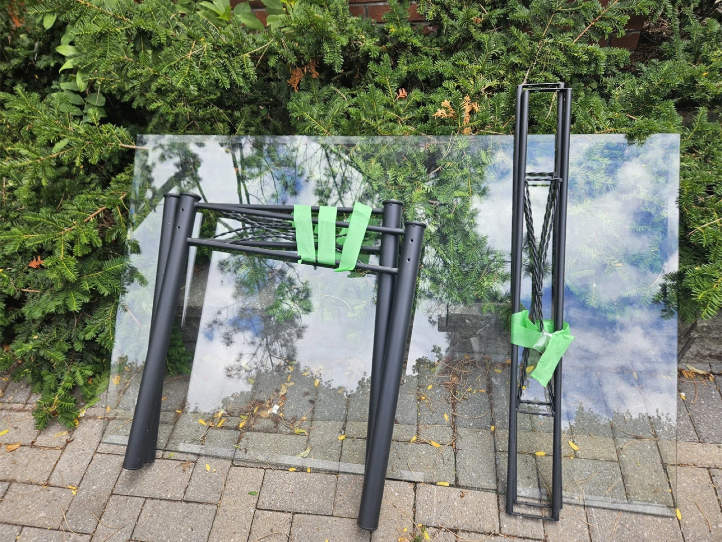 Glass table top with metal frame