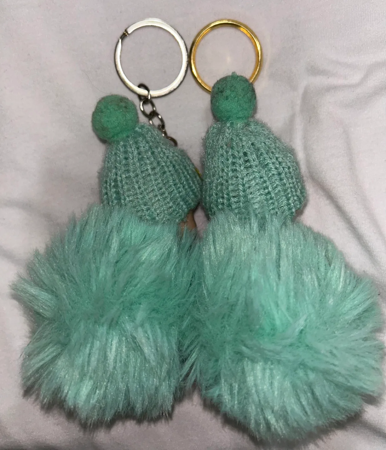 Two Turquoise Fluffy Keychain Baby Dolls image indicator(3)