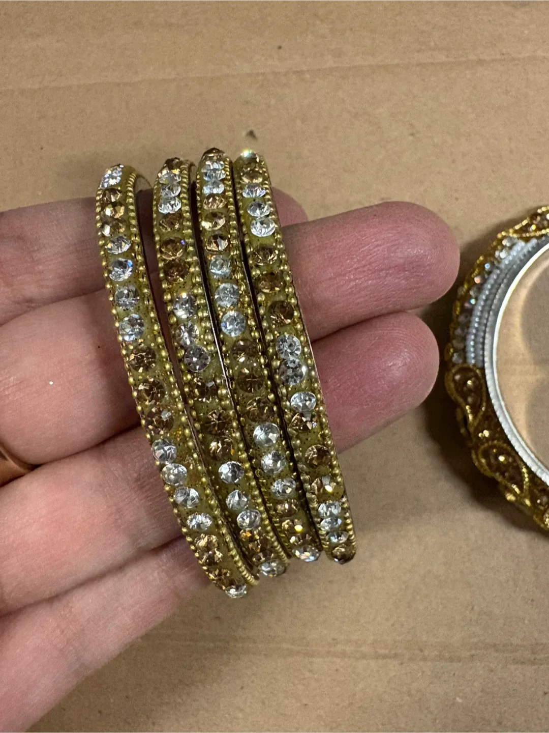 Gold-tone embellished bangle set image indicator(3)