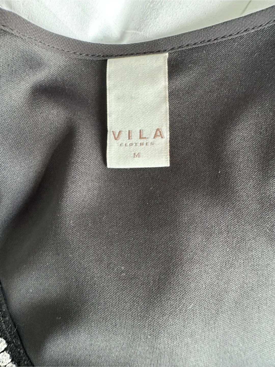 Black Sleeveless Dress with Embellished Neckline image indicator(7)