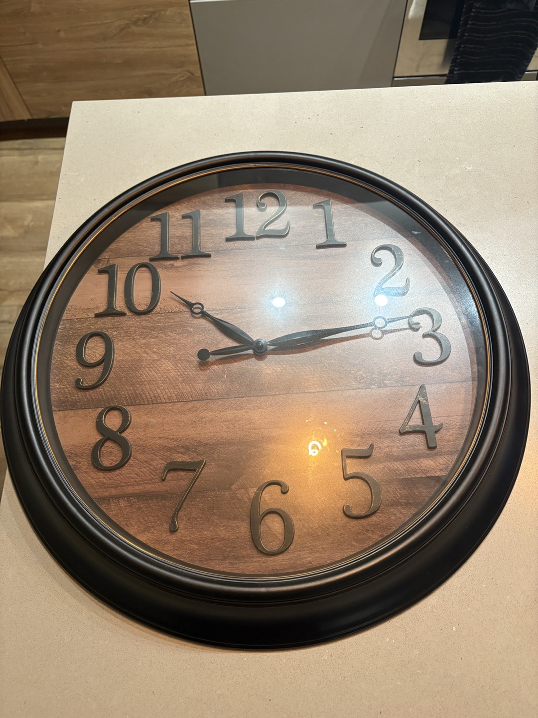 Wall clock with wood-look face