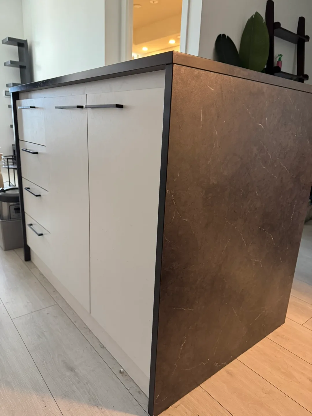 Kitchen Island with White Cabinets and Dark Countertop thumbnail