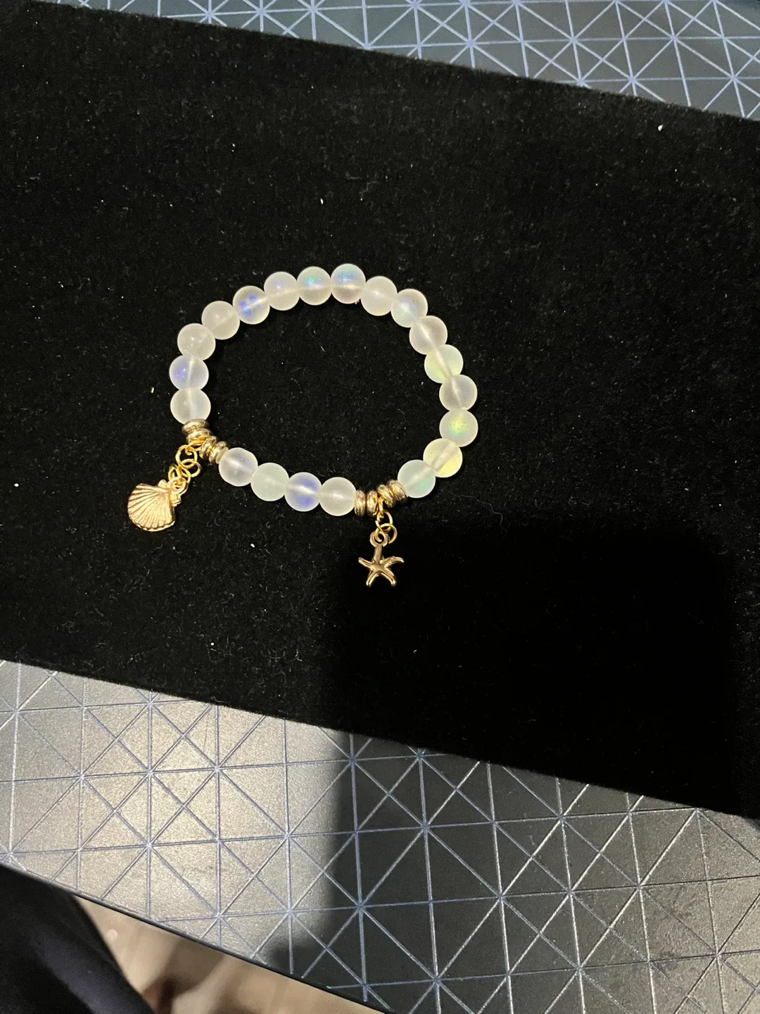 White Beaded Bracelet with Gold Charms thumbnail