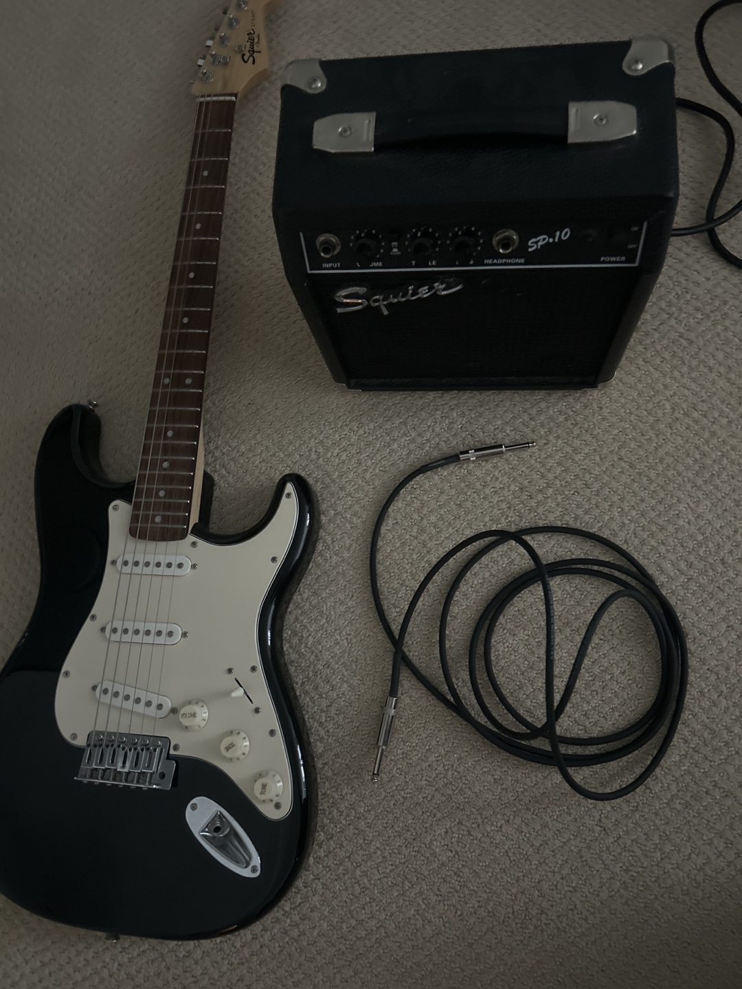 Squier by Fender Strat Electric Guitar and capo