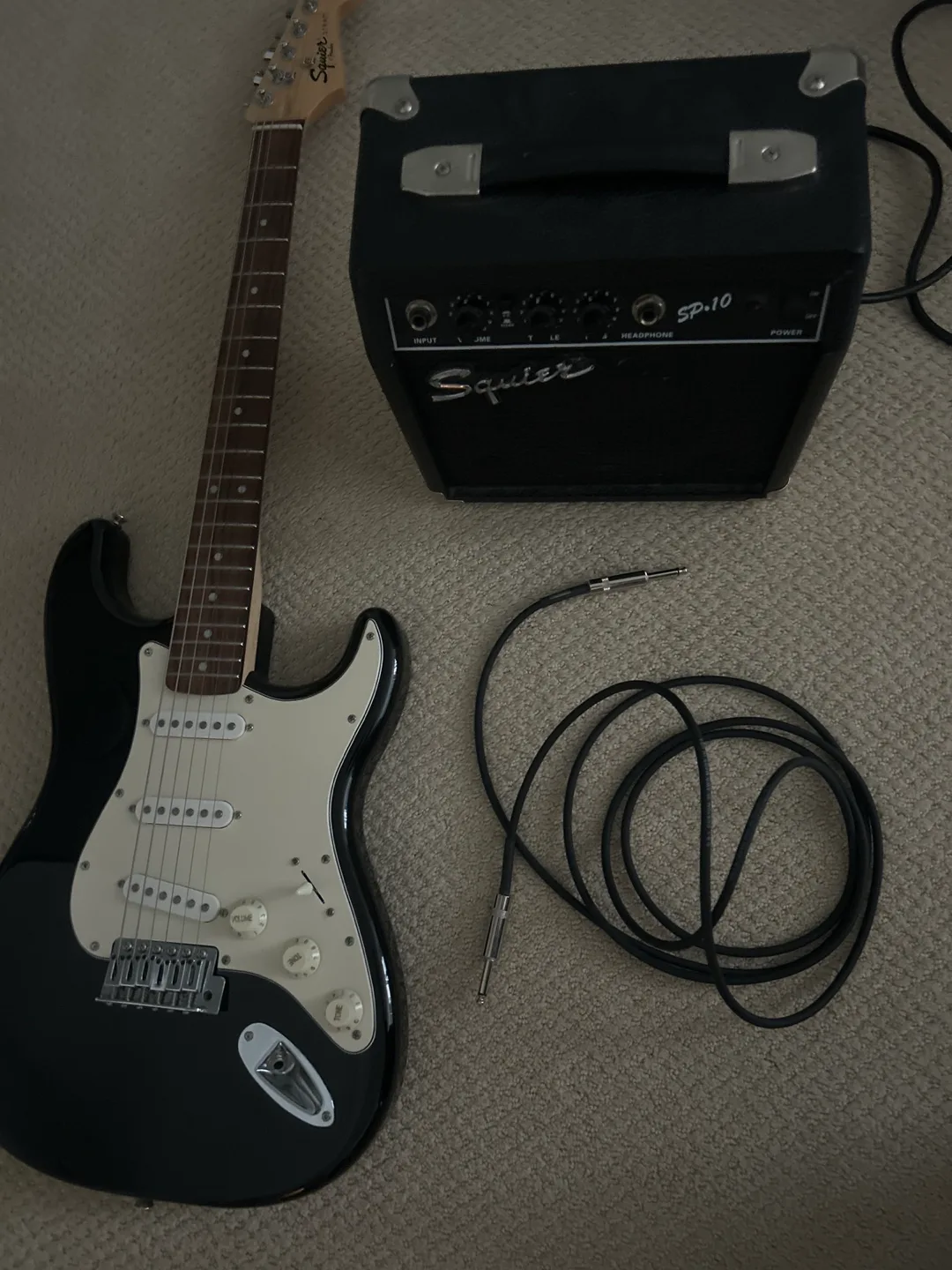 Squier by Fender Strat Electric Guitar and capo