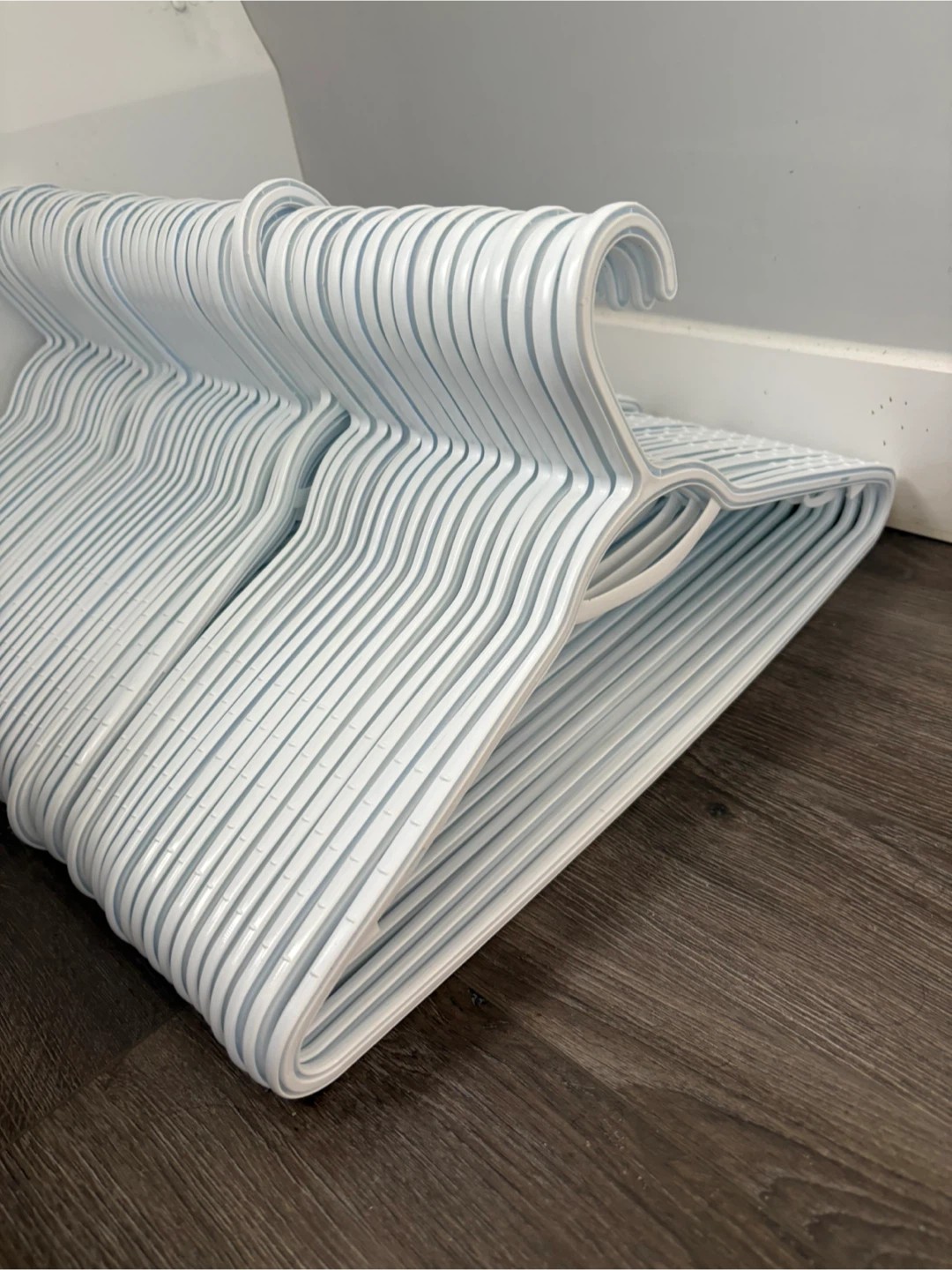 55 White Plastic Hangers-move out sale