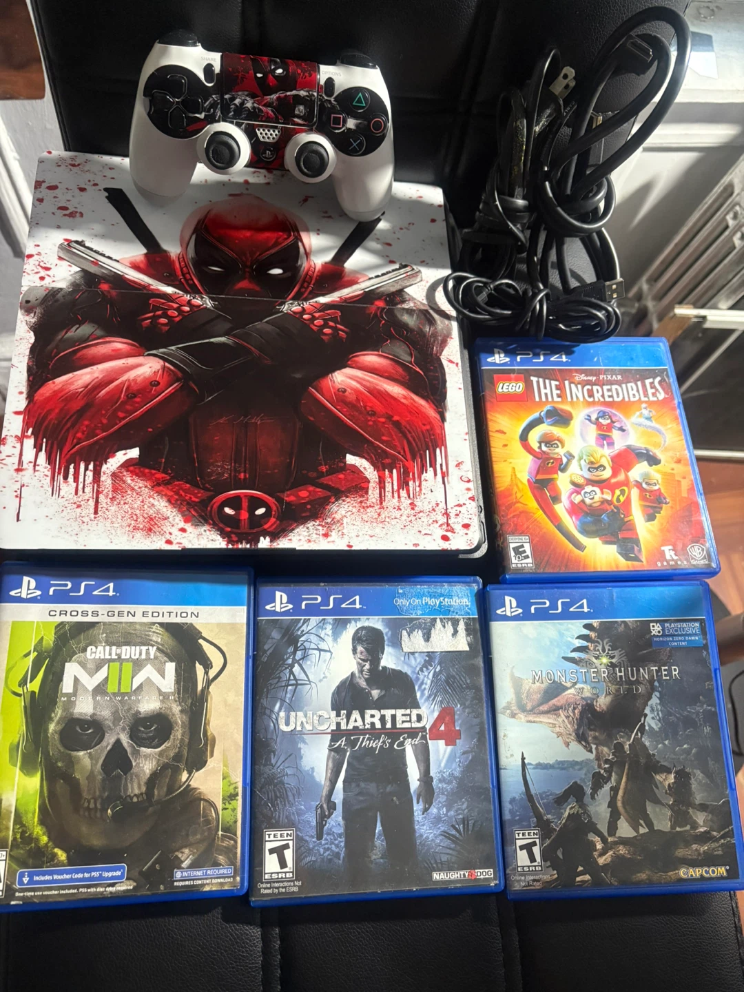 PS4 Console, Controller + 4 Games