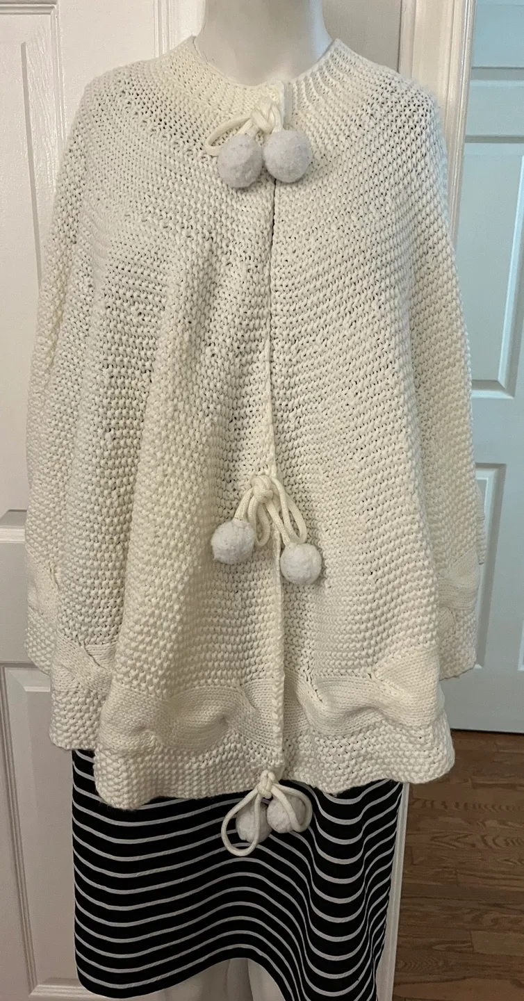 Cream Knit Cape with Pom Poms thumbnail