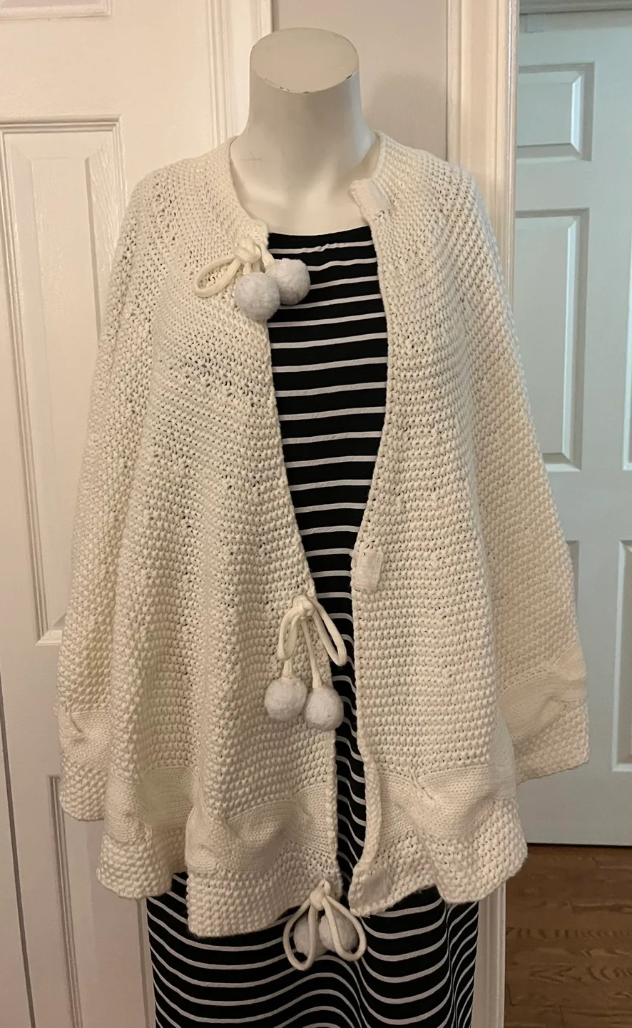 Cream Knit Cape with Pom Poms image indicator(3)